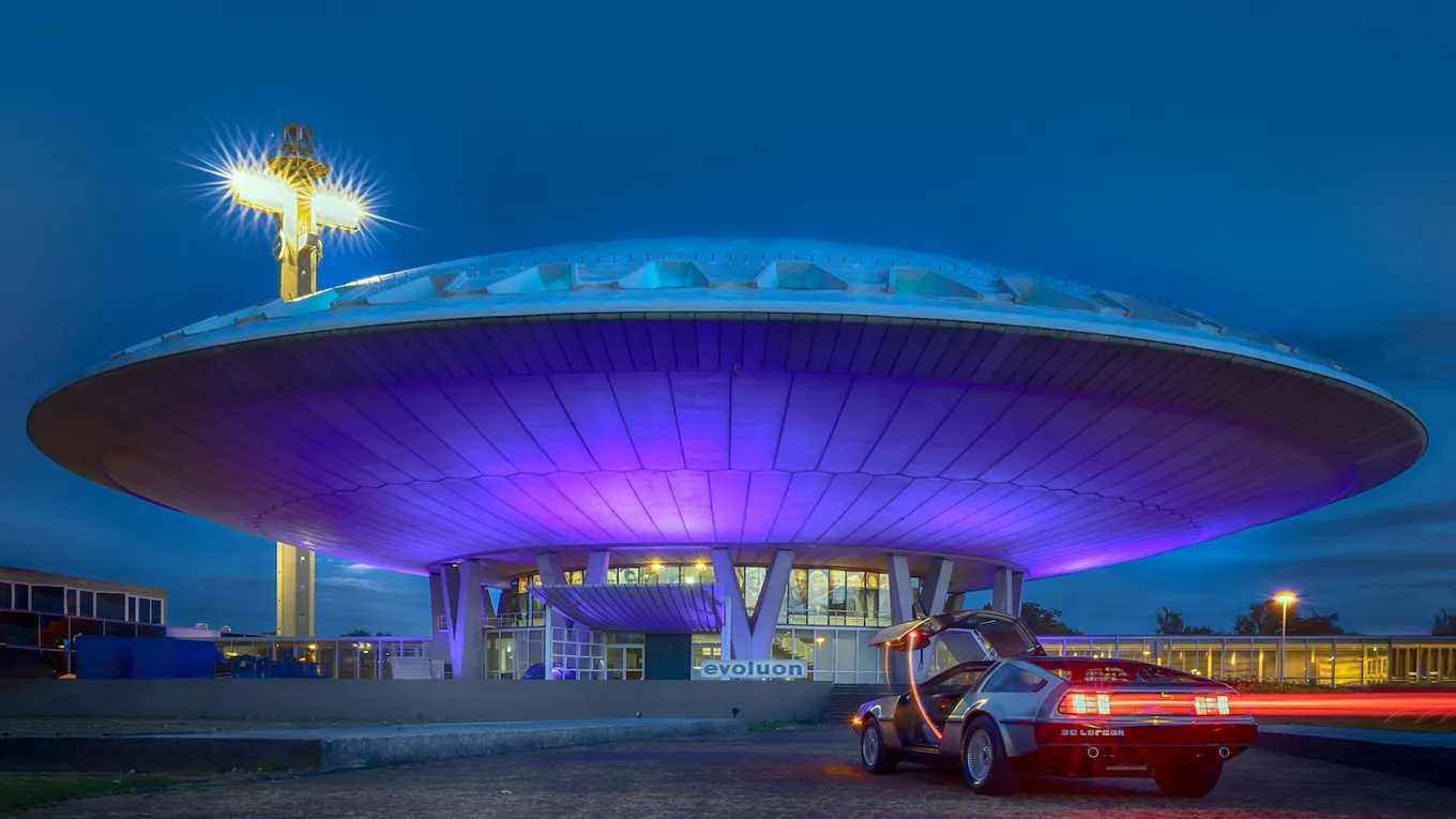 The Evoluon in Eindhoven at dusk, lit in purple